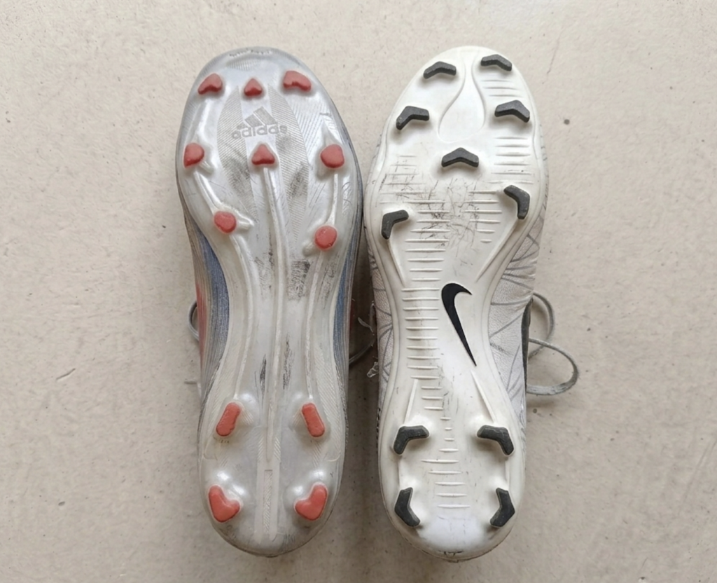 Soccer cleats soles compared - adidas and Nike stud patterns side by side